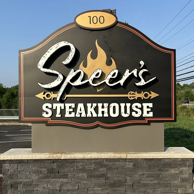 Custom restaurant monument sign for steakhouse with dimensional lettering and exterior signage design