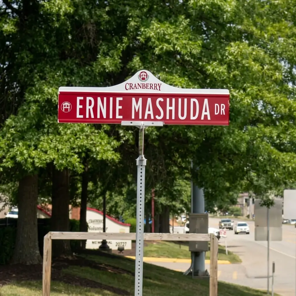 Custom branded red and white municipal street sign for Ernie Mashuda Drive featuring the Cranberry Township official crest logo, fabricated by Spark Signs in Cranberry Township PA