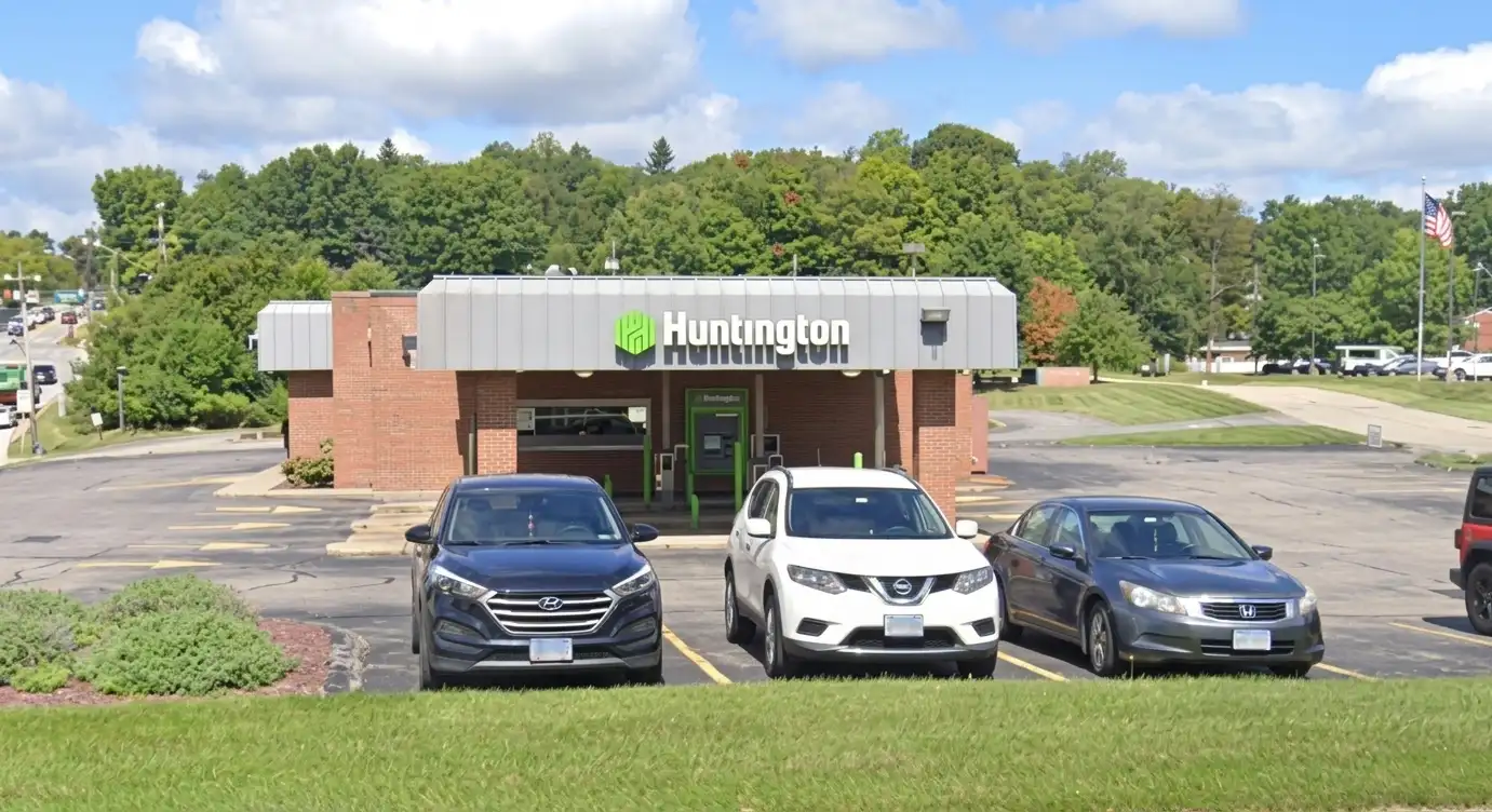 Illuminated channel letter sign for Huntington Bank mounted on the exterior canopy fascia of a standalone bank branch building, by Spark Signs in Moon Township PA