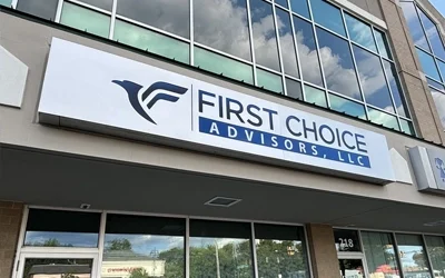 Exterior channel letter sign for First Choice Advisors on modern commercial building facade