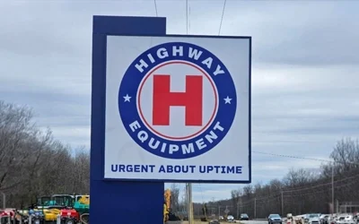 Roadside monument sign for Highway Equipment with large logo and tagline on freestanding structure
