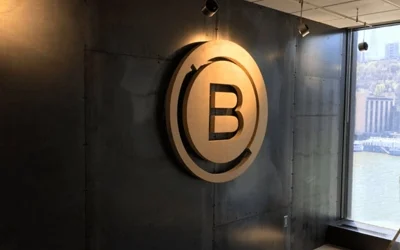 Exterior illuminated channel letter sign on restaurant building at night